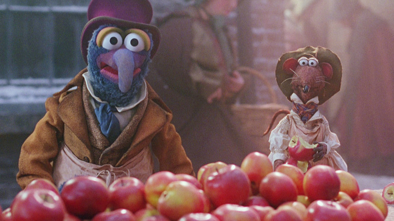 Gonzo the Great as Charles Dickens and Rizzo the Rat as himself sell/eat apples in The Muppet Christmas Carol