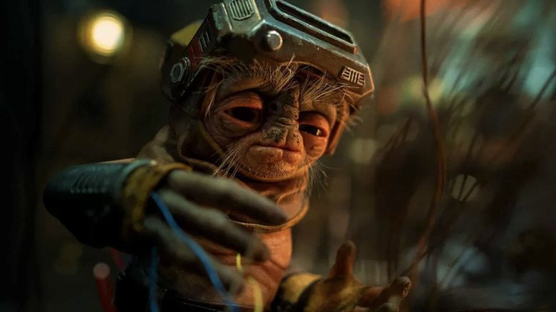 Shirley Henderson voicing Babu Frik as he works with wires on Kijimi in Star Wars: The Rise of Skywalker
