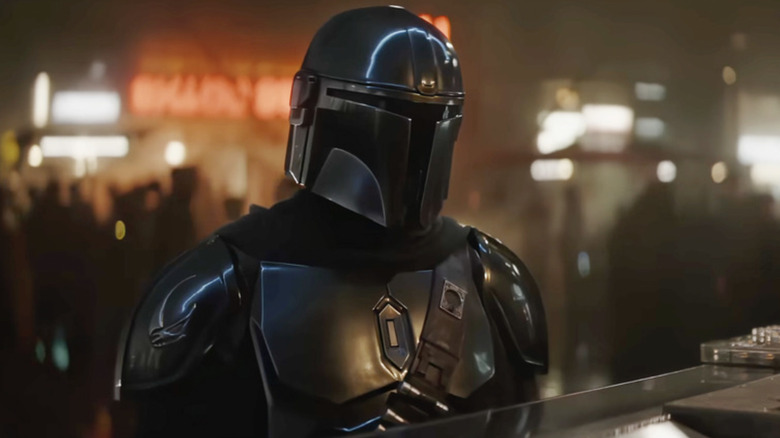 Pedro Pascal as Din Djarin ordering from Martin Scorsese's Hugo Durant's food counter on Shakari in The Mandalorian and Grogu