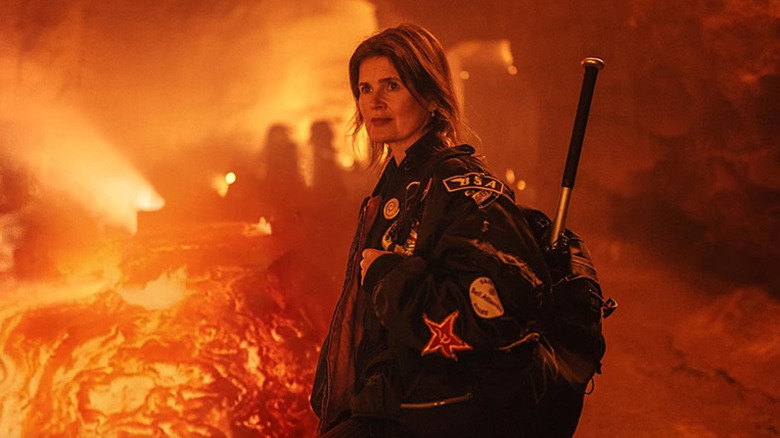 Ace (Sophie Aldred) stands in a volcano with her signature jacket and backpack in Doctor Who