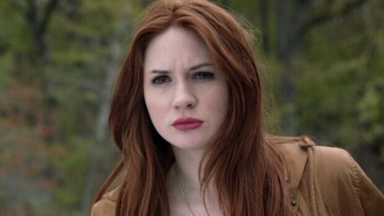 Amy Pond (Karen Gillan) stares in a forest in Doctor Who