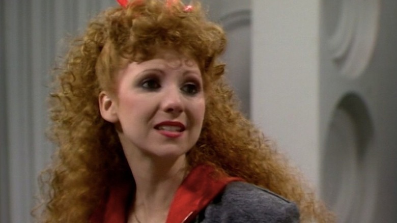 Mel Bush (Bonnie Langford) looks to her left in the TARDIS in Doctor Who