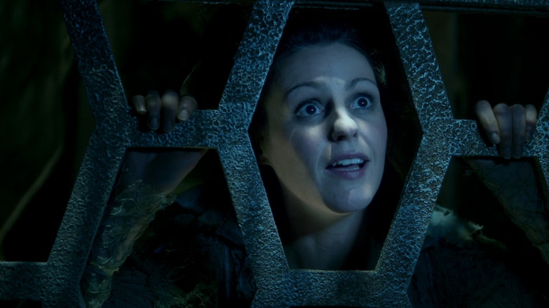 Idris (Suranne Jones) looking through cage in the Doctor Who episode The Doctor's Wife