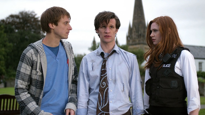 Rory (Arthur Darvill) and Amy (Karen Gillan) staring at Eleven (Matt Smith) in the Doctor Who episode The Eleventh Hour