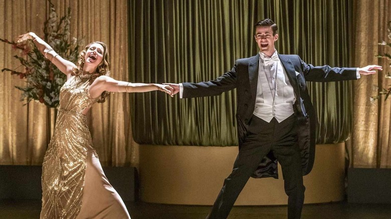 Melissa Benoist and Grant Gustin as Kara Danvers and Barry Allen, dancing in formal wear on The Flash