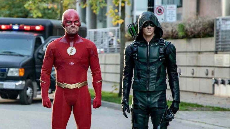 Stephen Amell and Grant Gustin as Oliver Queen and Barry Allen, dressed in each others' costumes on The Flash