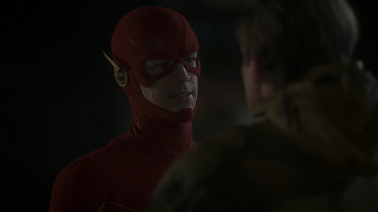 Grant Gustin and Matt Letscher as The Flash and the Reverse Flash, talking in the street on The Flash