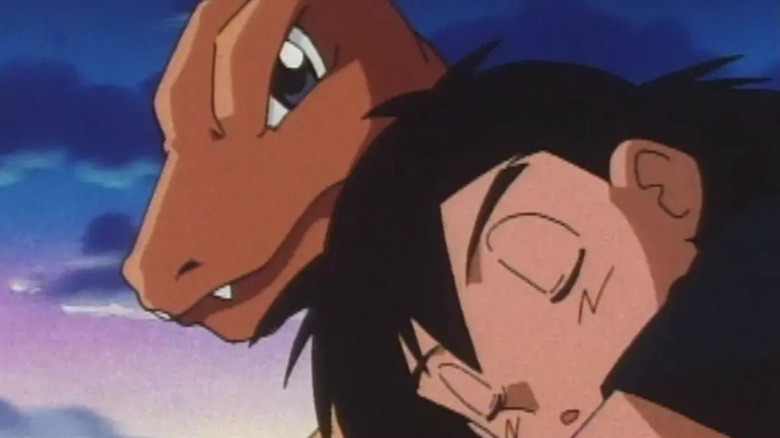 Ash without his hat sleeping against Charizard on the original Pokemon series