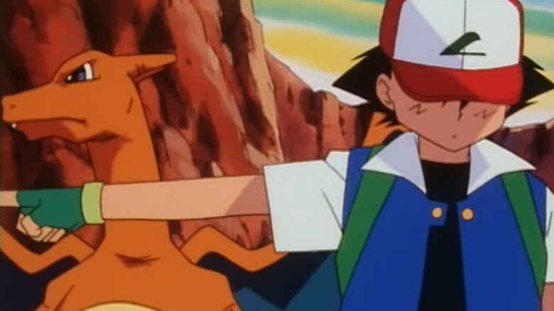 Ash turned away from Charizard and pointing left on the original Pokemon series