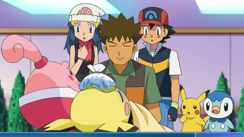 Dawn, Brock, Ash, Pikachu, and Piplup watching Happiny take care of a Pichu on Pokemon the Series: Diamond & Pearl