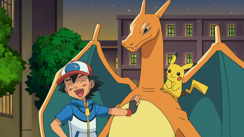 Ash resting his hand on Charizard with Pikachu in Pokemon the Series: Black & White
