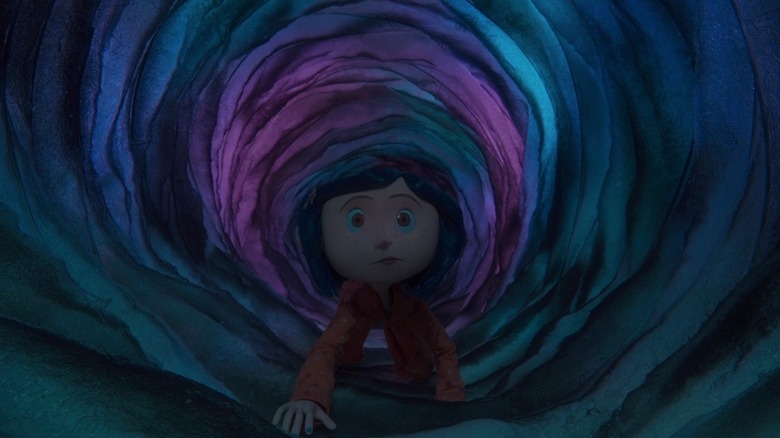 Dakota Fanning as Coraline Jones in Coraline, crawling through the portal to the other world.