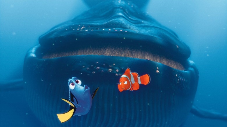 Albert Brooks as Marlin and Ellen DeGeneres as Dory in Finding Nemo, with Marlin distracted by Dory's antics as a huge whale approaches them from behind.
