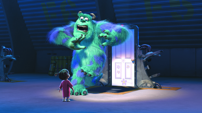 John Goodman as James P. "Sulley" Sullivan and Mary Gibbs as Boo in Monsters, Inc., as Sully screams in terror while looking down at the tiny Boo.
