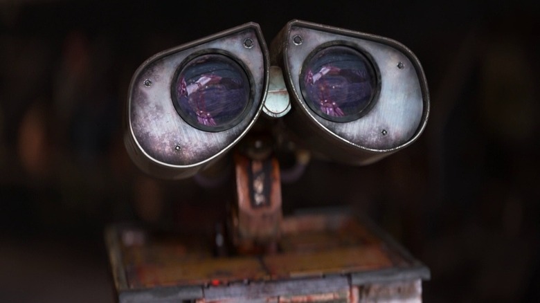 A close-up of Ben Burtt as WALL-E, his binocular eyes looking up in to the sky.