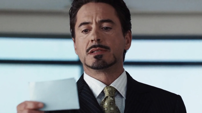 Tony Stark (Robert Downey Jr.) reads from a card in Iron Man