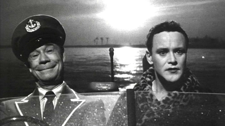 Osgood Fielding III (Joe E. Brown) smiles while driving a boat with Jerry (Jack Lemmon) in Some Like It Hot