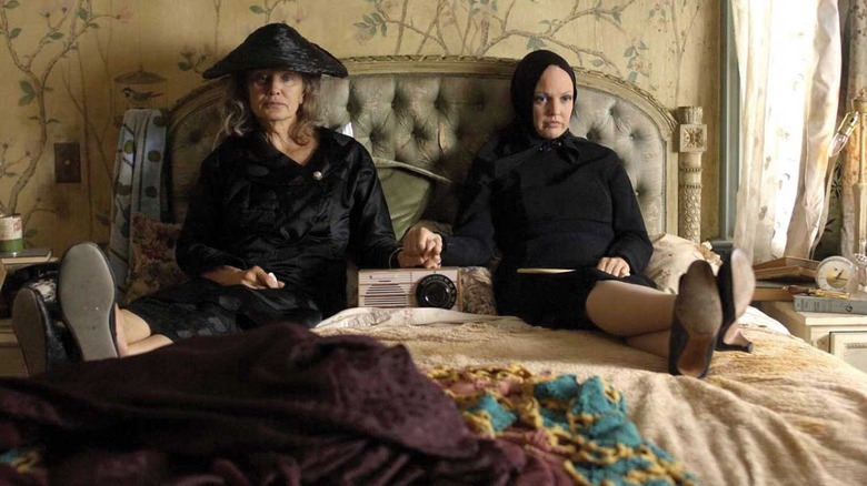 Jessica Lange and Drew Barrymore as Big Edie and Little Edie sitting together on a bed in the 2009 film Grey Gardens