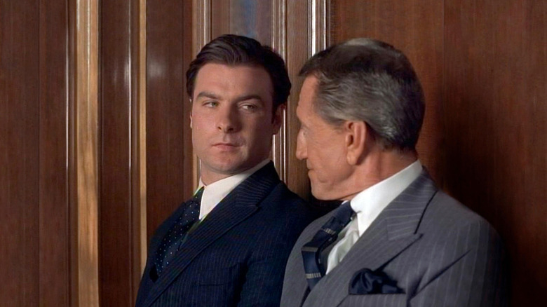 Liev Schreiber and Roy Scheider as Orson Welles and George Schaefers speaking against a wall in RKO 281