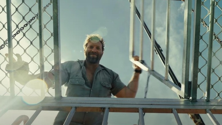 Tucker closes a shark cage on an unsuspecting victim in Dangerous Animals