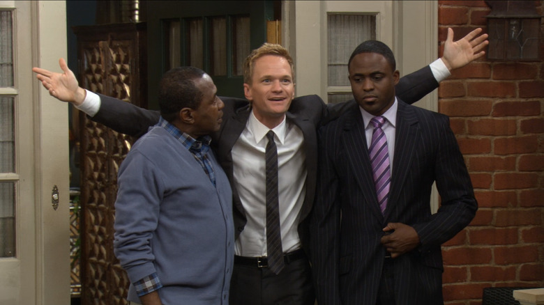 Barney Stinson (Neil Patrick Harris) excitedly puts his arms around James Stinson (Wayne Brady) and Sam Gibbs (Ben Vereen) in How I Met Your Mother