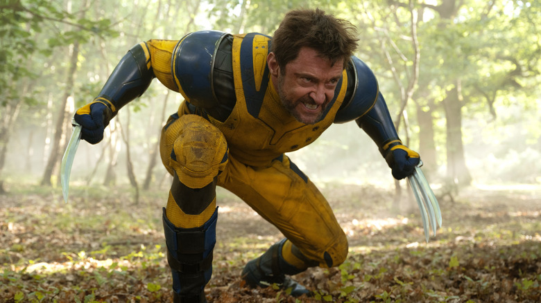 Hugh Jackman carries Dogpool as Wolverine in Deadpool & Wolverine