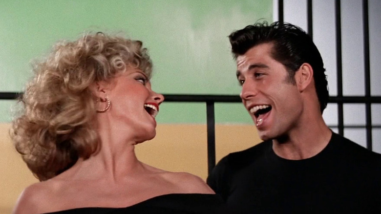 Olivia Newton-John as Sandy Olsson and John Travolta as Danny Zucko sing "You're the One That I Want" in Grease