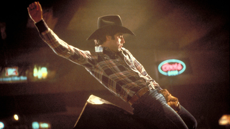 John Travolta as Buford Uan "Bud" Davis riding a mechanical bull in Urban Cowboy