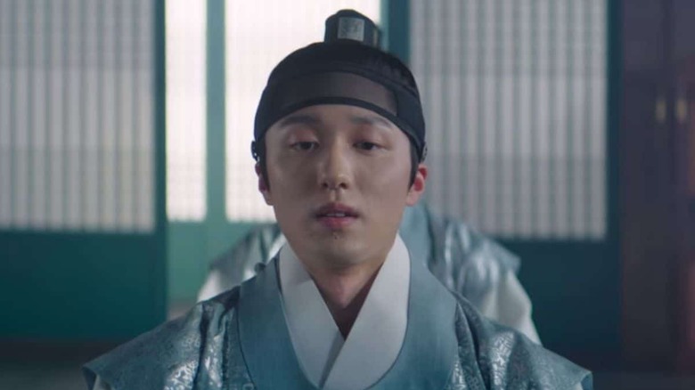 Prince Uiseong (Kang Chan-hee) sits in the royal court in Under the Queen's Umbrella