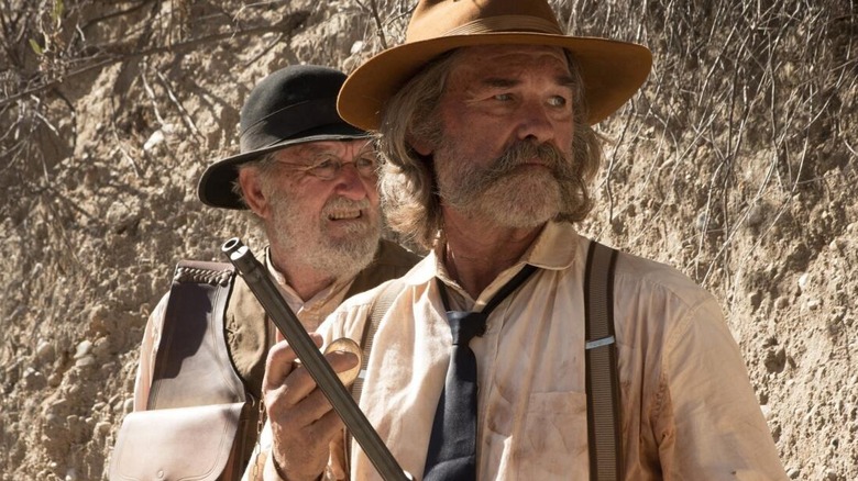 Richard Jenkins as Deputy Chicory and Kurt Russell as Sheriff Franklin Hunt look concerned in Bone Tomahawk