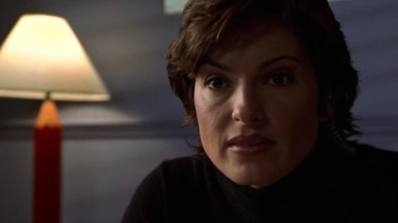 Olivia Benson (Mariska Hargitay) sits by a lamp in Law & Order: Special Victims Unit