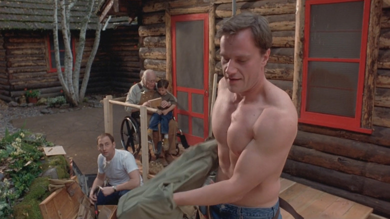 Arye Gross as Henry looks at Tim DeKay taking his shirt off as Dean in Big Eden