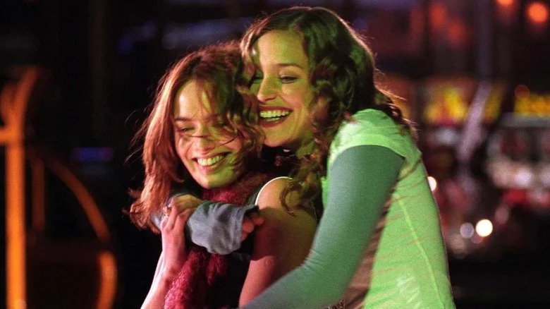 Piper Perabo as Rachel smiling and hugging Lena Headey as Luce from behind in Imagine Me & You