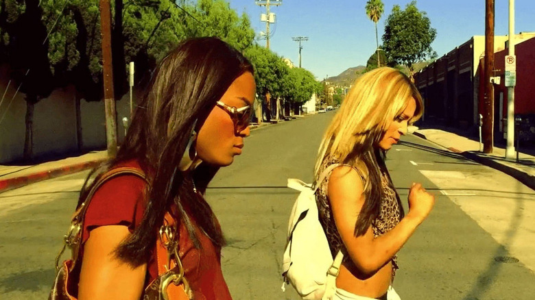 Mya Taylor as Alexandra and Kitana Kiki Rodriguez as Sin-Dee-Rella walk across the street in Tangerine