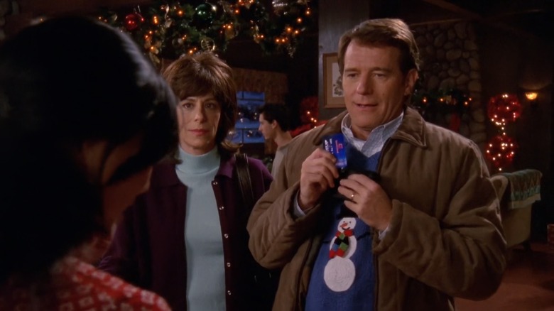 Hal (Bryan Cranston) holding a credit card on Malcolm in the Middle