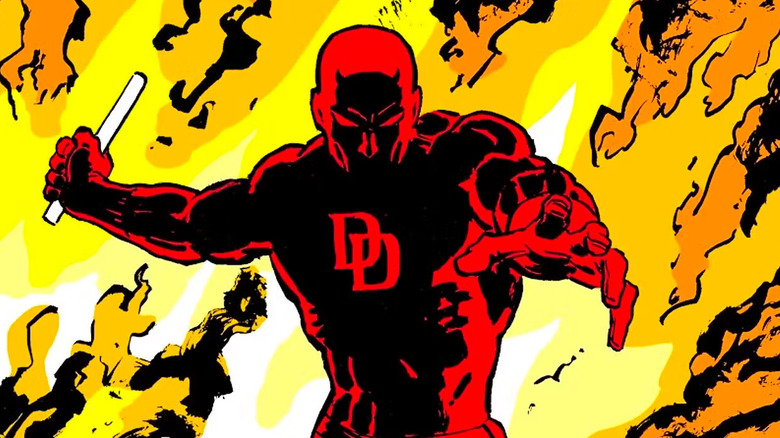 Daredevil wielding a baton in front of an inferno in a Daredevil: Born Again comic cover