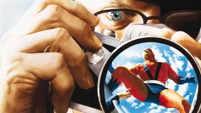 A close-up of Phil Sheldon taking a photo with Giant Man in his camera's reflection from Marvels