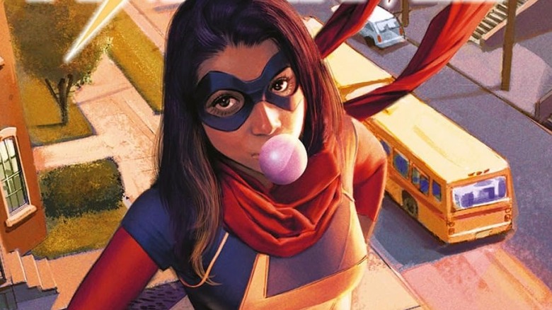 Kamala Khan in her Ms. Marvel costume blowing a gum bubble on a roof in a Ms. Marvel comic cover