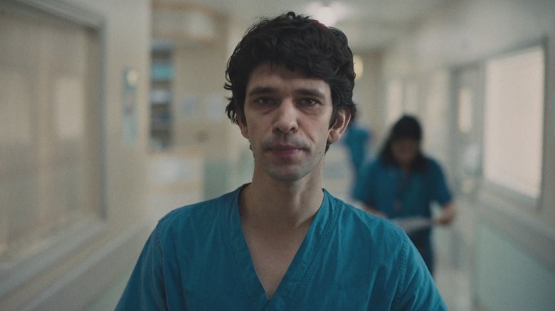 Ben Whishaw as Adam Kay staring at the camera on This Is Going to Hurt