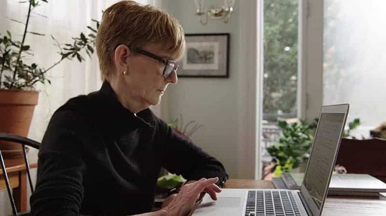 Lisa Sanders checks her laptop at a table in Diagnosis
