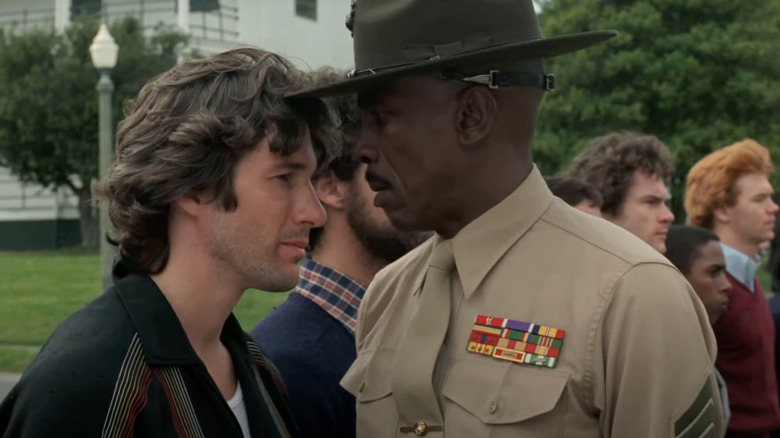 Richard Gere as Zack Mayo stands next to Louis Gossett Jr. as Gunnery Sergeant Emil Foley in An Officer and a Gentleman