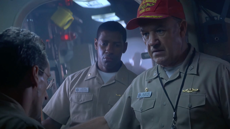 Denzel Washington as Lieutenant Commander Ron Hunter and Gene Hackman as Captain Frank Ramsey listen to orders in Crimson Tide