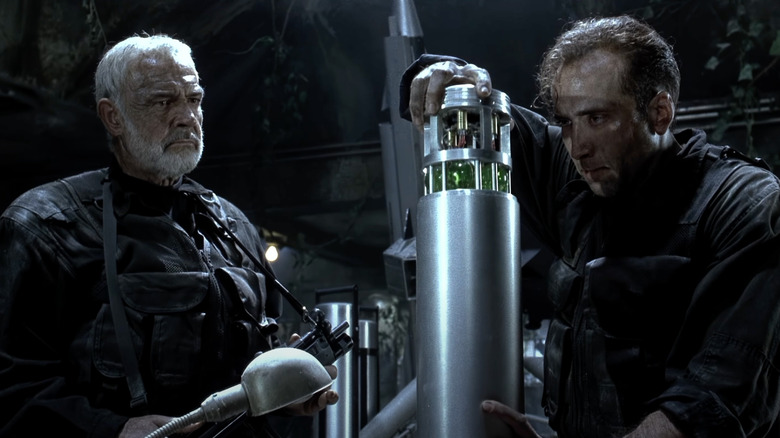 Sean Connery as John Patrick Mason watches Nicolas Cage as Stanley Goodspeed work on a bomb in The Rock