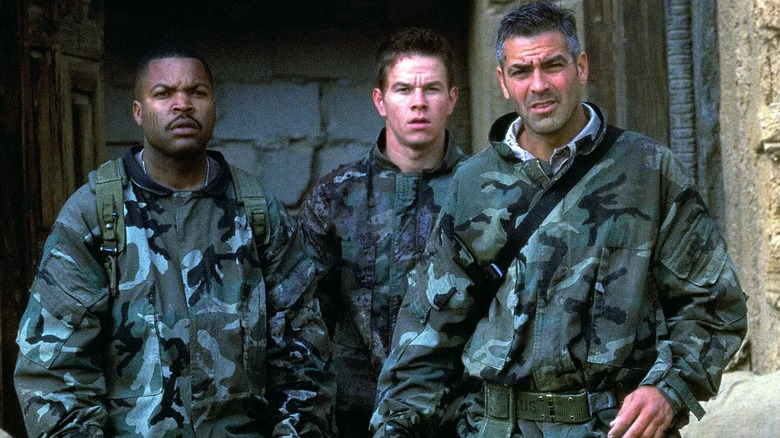 Ice Cube as Staff Sergeant Chief Elgin, Mark Wahlberg as Sergeant First Class Troy Barlow, and George Clooney as Major Archie Gates stand next to each other in Three Kings