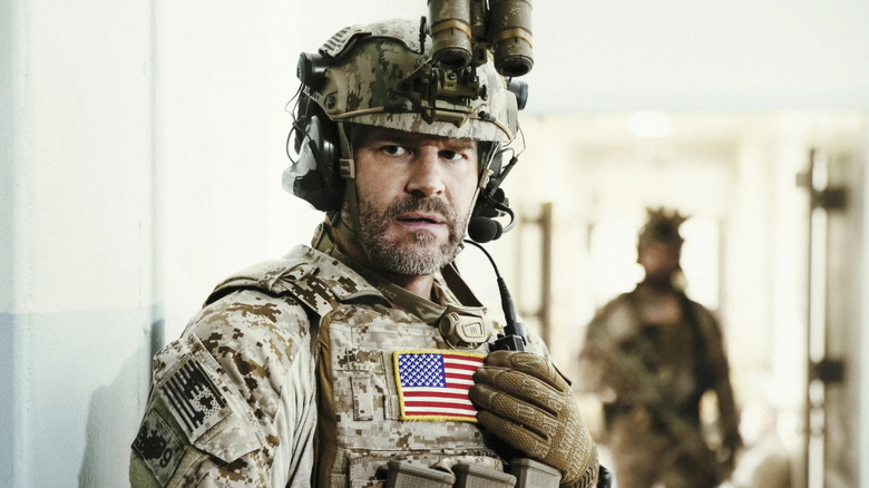 Hayes (David Boreanaz) adjusts his gear in SEAL Team.