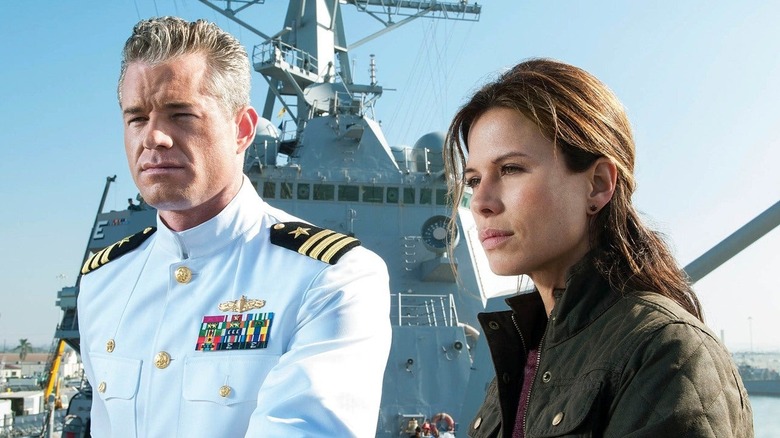 Chandler (Eric Dane) and Scott (Rhona Mitra) stand on the USS Nathan James in The Last Ship.