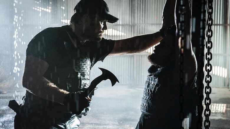 Reece (Chris Pratt) threatens an enemy with a tactical hatchet in The Terminal List.