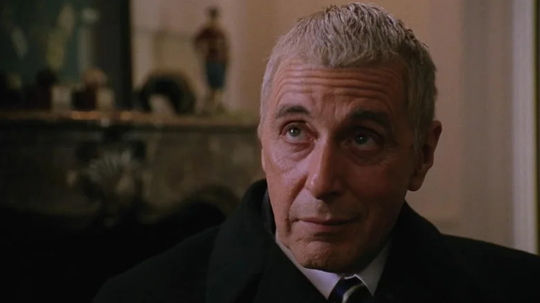 Roy Cohn (Al Pacino) looks up with a wry smile in Angels in America