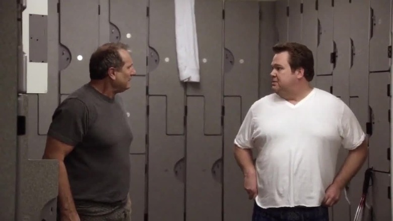 Ed O'Neill and Eric Stonestreet as Jay and Cameron in a locker room on Modern Family