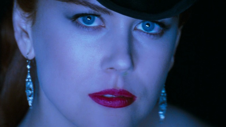 A closeup of a blue-lit Nicole Kidman as Satine in Moulin Rouge!